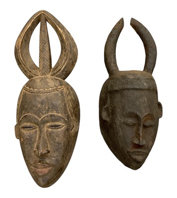Lot 1016 - Two African carved wooden tribal horned masks,...