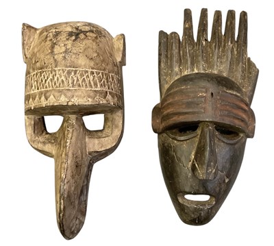 Lot 1017 - Two African carved wooden tribal masks...