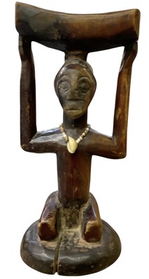 Lot 1047 - An African carved wooden tribal Luba caryatid...