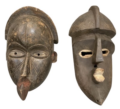Lot 1012 - Two African carved wooden tribal masks...