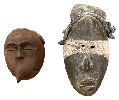 Lot 1035 - A West African carved wooden tribal mask from...