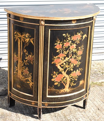 Lot 65 - A reproduction black lacquer and gilt...