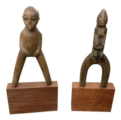 Lot 1038 - Two carved wooden tribal Lobi Burkina Faso...