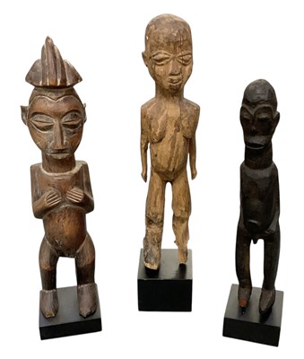Lot 1040 - Three African carved wooden tribal ancestral...