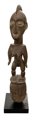 Lot 1042 - An African carved wooden tribal Hemba-Luba...
