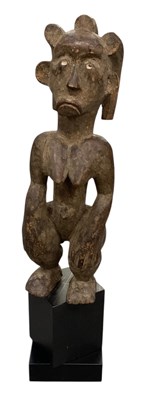 Lot 1043 - An African carved wooden tribal Chokwe...