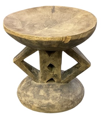 Lot 1032 - A Zimbabwean carved wooden tribal Tonga stool,...