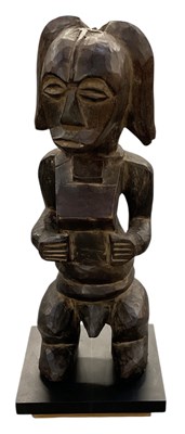 Lot 1003 - An East African Tanzanian carved wooden tribal...