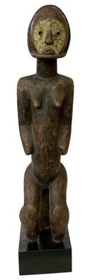 Lot 1026 - An African carved wooden tribal Lobi Bateba...