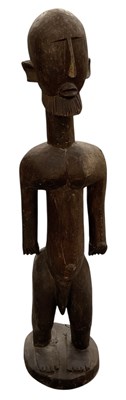 Lot 1005 - An African carved wooden tribal Lobi figure,...