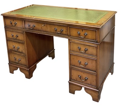 Lot 51 - A reproduction yew wood pedestal desk, with...