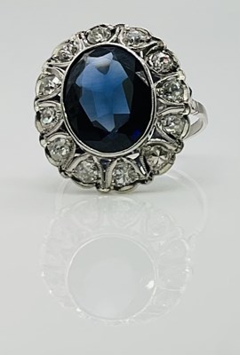 Lot 562 - A white metal sapphire and diamond large oval...