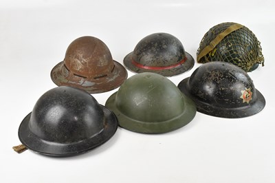 Lot 1297 - Six British military and other helmets,...