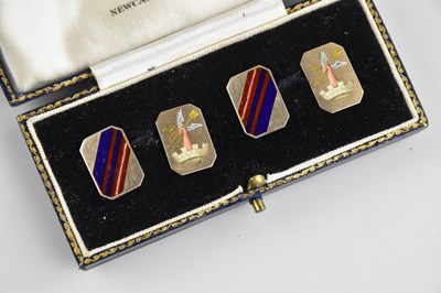 Lot 1354 - A pair of yellow metal and enamelled cufflinks...