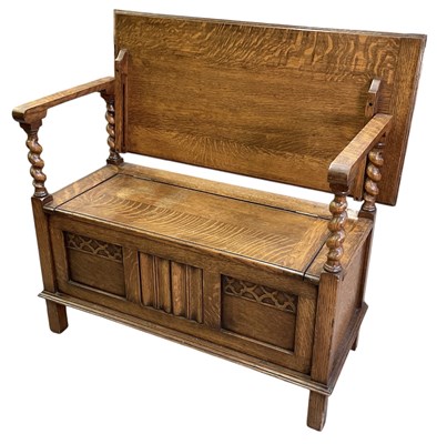 Lot 53 - An early 20th century carved oak monk's bench,...