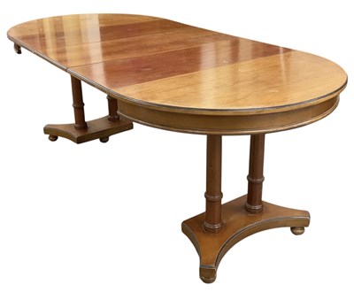 Lot 32 - A reproduction cherrywood circular extending...