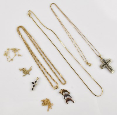 Lot 2105 - A 9ct yellow gold illusion set crucifix, set...