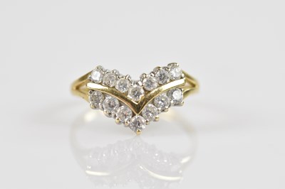 Lot 2432 - A yellow metal dress ring, stamped '585', set...