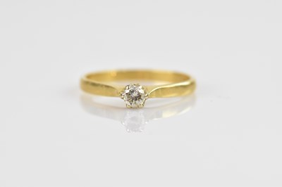 Lot 2456 - An 18ct yellow gold diamond solitaire ring,...