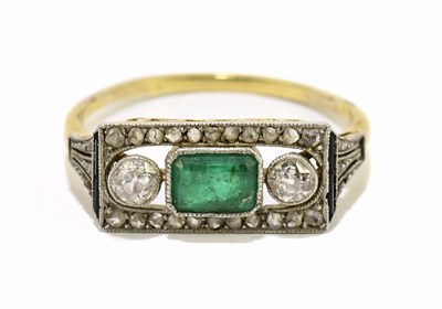 Lot 1086 - A yellow metal Art Deco emerald and diamond...
