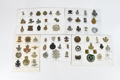 Lot 1221 - A large collection of WWI and later cap badges,...