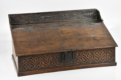 Lot 297 - An 18th century carved oak bible box, height...