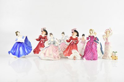 Lot 1619 - ROYAL DOULTON; a collection of nine figures...