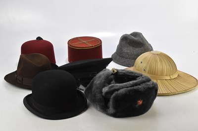 Lot 405 - A collection of vintage hats including a fez,...