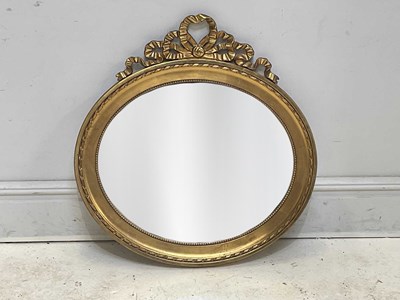 Lot 32 - A decorative Regency style gilt framed oval...