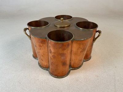 Lot 320 - A reproduction copper and brass four sectioned...