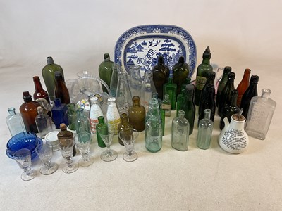 Lot 192 - A quantity of early glass bottles, together...