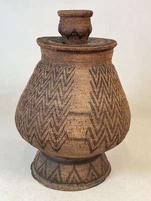 Lot 107 - An Apache Native American woven olla storage...