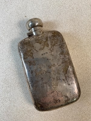 Lot 530 - A sterling silver hip flask of slightly convex...