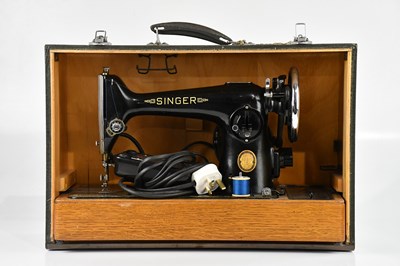 Lot 331 - SINGER; a cased sewing machine.