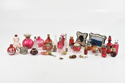 Lot 1772 - A collection of cranberry glass scent bottles...