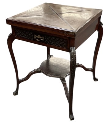 Lot 64 - An Edwardian mahogany two tiered single drawer...