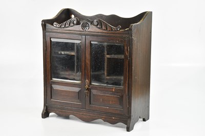 Lot 321A - An early 20th century oak smoking cabinet, 46...