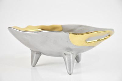 Lot 1569 - DAVID MARSHALL; a cast metal twin handled bowl,...