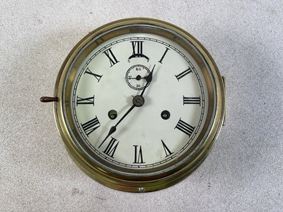 Lot 829 - A brass cased ship's bulkhead clock with...