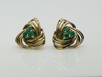 Lot 583 - A pair of 9ct yellow gold emerald set trefoil...