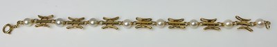 Lot 591 - A 9ct yellow gold and seed pearl bracelet,...
