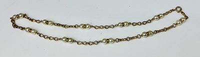 Lot 592 - A 9ct yellow gold and seed pearl necklace,...