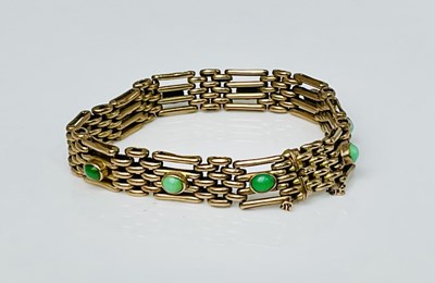 Lot 598 - A 9ct yellow gold and turquoise set four bar...