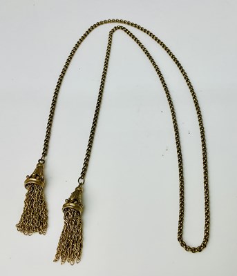Lot 602 - A 9ct yellow gold chain with double tassel end...