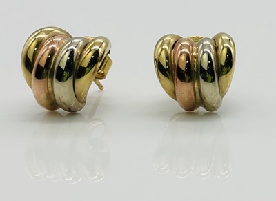 Lot 603 - A pair of 9ct three tone gold hoop earrings,...