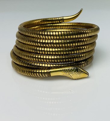 Lot 605 - A rolled gold sprung serpent coiled...