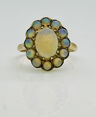 Lot 615 - A 9ct yellow gold opal floral oval cluster...