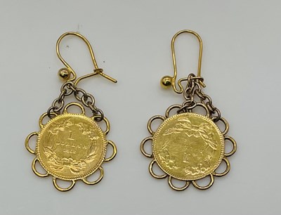 Lot 617 - A pair of 9ct yellow gold earrings set with...