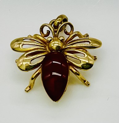 Lot 618 - A 9ct yellow gold insect pendant, with...