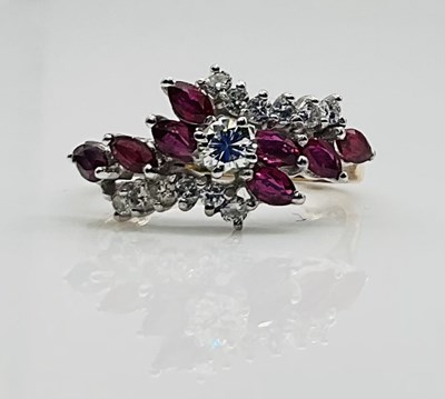 Lot 629 - A 9ct yellow gold ruby set dress ring, approx...